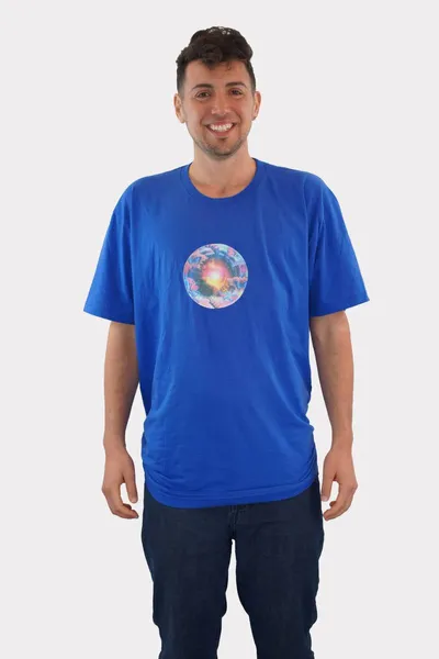 A circular image of a yellow, pink, and white nebula surrounded with pink, purple and blue butterflies, caterpillars and clouds glitter printed on a blue t-shirt, worn by a white man.